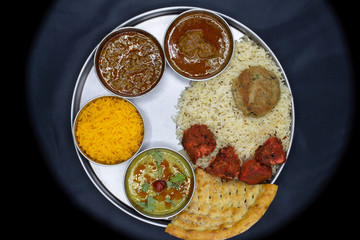 Rice with chicken tikka cutlet and salad salan with sweet top view