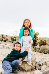 Siblings Exploring Desert Landscape