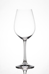 Silhouette of an empty wine glass against white background with reflection in Zurich, Europe, Switzerland.