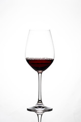 Silhouette of a wine glass against white background with reflection in Zurich, Europe, Switzerland.