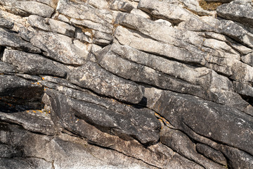 Structure of surface of the stone, used as background. Stone texture. Natural rocks