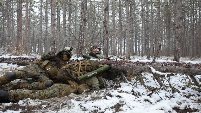 Winter forest. Soldier reported the situation by radio, takes MANPADS and aims