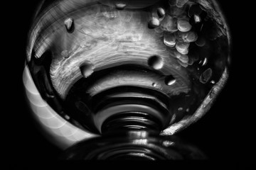 A glass of liquid. Glass. Monochrome Blurred background.