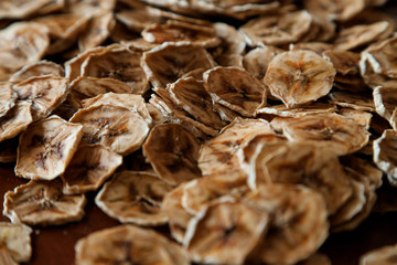 Homemade Dehydrated Banana Chips. dehydrated slices of bananas. healthy food. healthy snack
