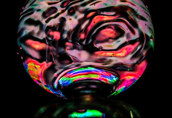 A glass of liquid. Glass. Color backlight.