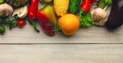 Fresh vegetables on vintage wooden background with copy-space