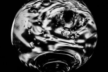 A glass of liquid. Glass. Monochrome Blurred background.