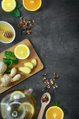 Pieces of ginger. Composition with lemon, honey and mint on black background. Top view, flat lay, copy space