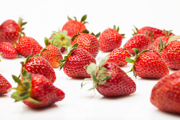 Strawberries with leaves isolated on white background