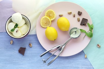 Natural ice cream, lemons on a wooden table, homemade dessert, healthy food