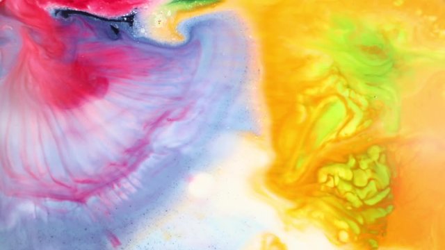 Abstract Colorful Paint Liquid Artistic Movement. Beautiful spread of Colored paint in liquid, realtime shot. Multi Colour Inks in milk.