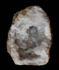 Clear quartz geode isolated on a black background