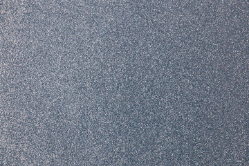 texture of shiny silver paper with a blue tint