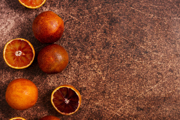 Red Spanish oranges fruit at rustic background