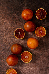 Red Spanish oranges fruit at rustic background