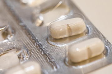 A pile of pills in blister packs.