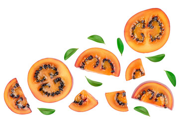 Fresh tamarillo fruit slices with leaves isolated on white background. Top view. Flat lay. Set or collection