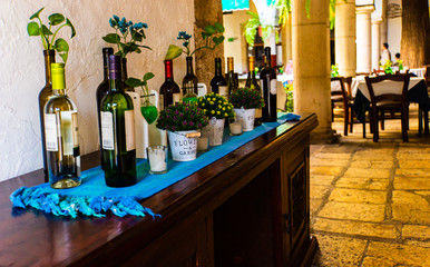 a buffet arrangement of bottles of wine 