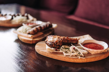 Grilled meat and kebab with pita bread and pickled onions and tomato sauce