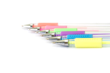 multi-colored pens on a white background. Copy space. Place for text.