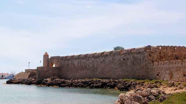View of the embankment and the medieval fortress, Mandraki Harbour, Rhodes, Greece