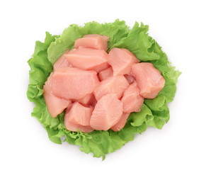 Fresh chicken fillet with lettuce isolated on white background with clipping path and full depth of field. Top view. Flat lay