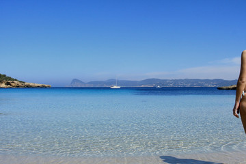 Deserted beach with turquoise waters, bright day