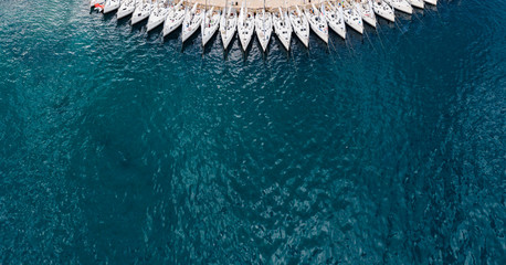 Aerial panoramic view of a lot of moored sailboats of a sail regatta, is the city Komiza - the one...