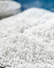 Closeup of a granule of white plastic polymer