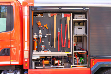 Modern fire truck. Rescue equipment, axe, bolt cutter