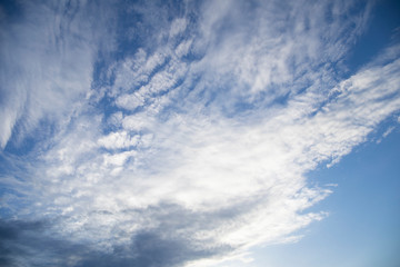 Moody evening sky in pink and grey shadows clouds