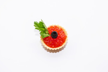 red caviar in tartlets close up on a white background