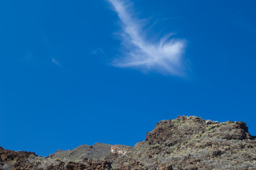 Fototapeta na wymiar Cliff and cloud in the Timijiraque Protected Landscape. El Hierro. Canary Islands. Spain.