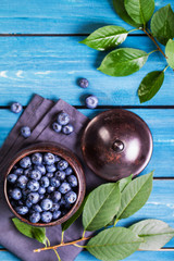 Freshly picked blueberries in metal bowl. Concept for healthy eating and nutrition.