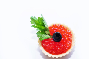 red caviar in tartlets close up on a white background