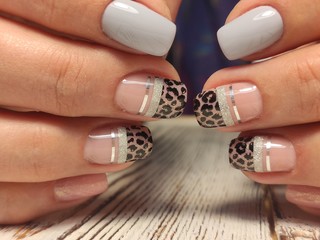 Beautiful nail design on female hands on background.