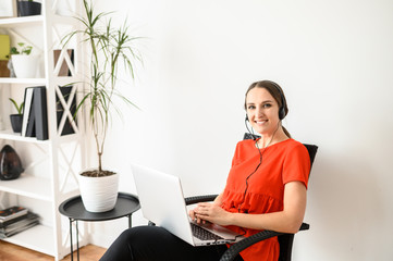 Woman using headset and pc for work