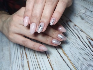 Naklejka premium Beautiful nail design on female hands on background.