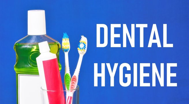 Dental hygiene the inscription. A tube of toothpaste, mouthwash and personal hygiene brushes that clean the surface of the teeth from plaque and food residues, as well as massage the gums.