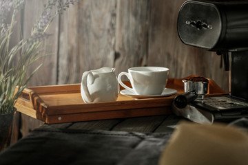 Coffee on a wooden table in the glow of the morning sun