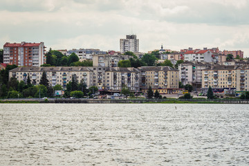 Fototapeta na wymiar View from Park of Taras Shevchenko with buildings over lake in Ternopil, Ukraine