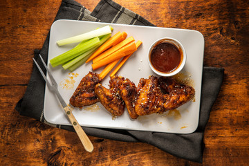 Grilled chicken wings with BBQ sauce.