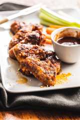 Grilled chicken wings with BBQ sauce.