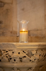 votive candle on stone