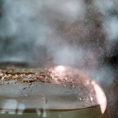 Closeup on the clear glass vase with water droplets, still life photography
