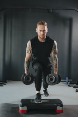 fitness trainer squats exercising with dumbbells