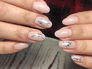 Beautiful nail design on female hands on background.