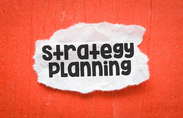 STRATEGY PLANNING word on small cards and red background. Business concept.