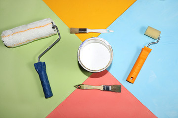 Repair tools on a multi-colored painted background. Shop banner, geometry. Minimal renovation and...