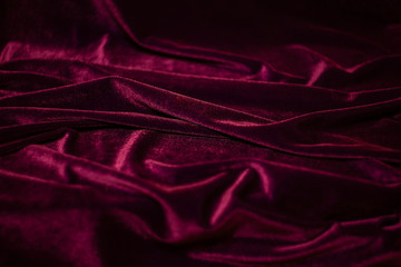 Velvet fabric with pleats as background.